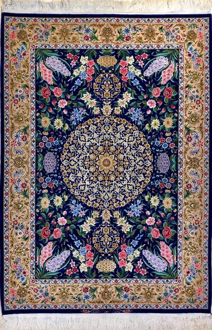 "Authentic blue Persian rug hand-knotted in Isfahan by Saieed Davarie, featuring a wool and silk blend in a floral design."